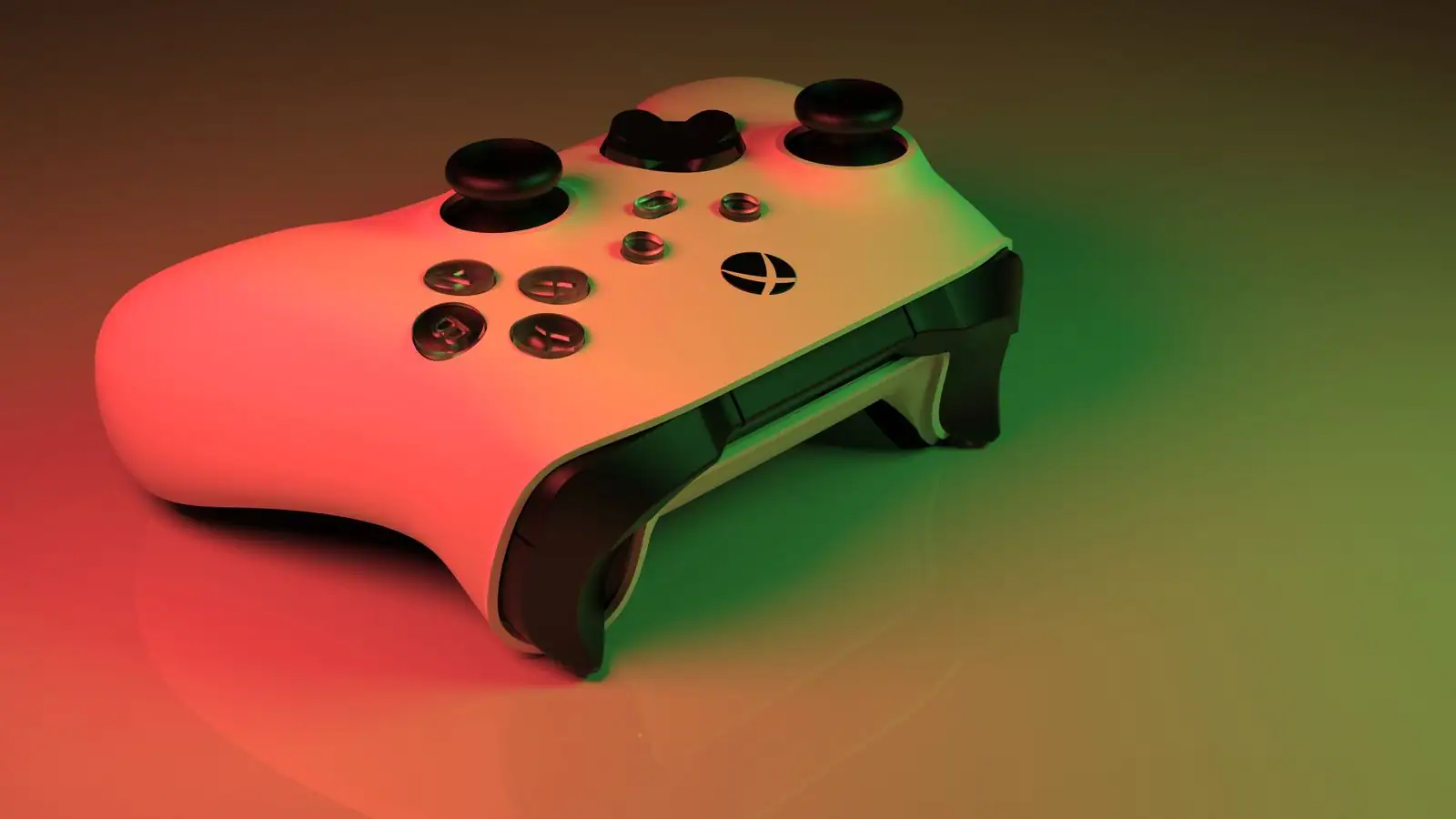 Une manette Xbox blanche éclairée d'une lumière verte et rouge, son bouton central marqué du logo Xbox.